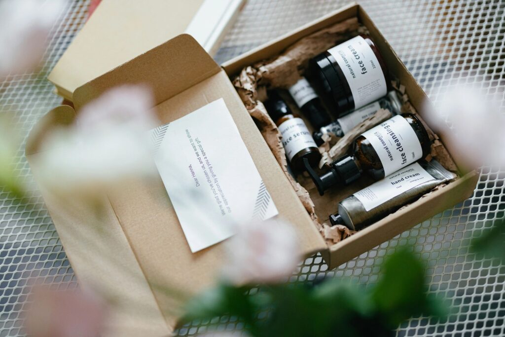 Open Gift Box With Natural Cosmetic Products Inside and Paper Note (Copy Space)