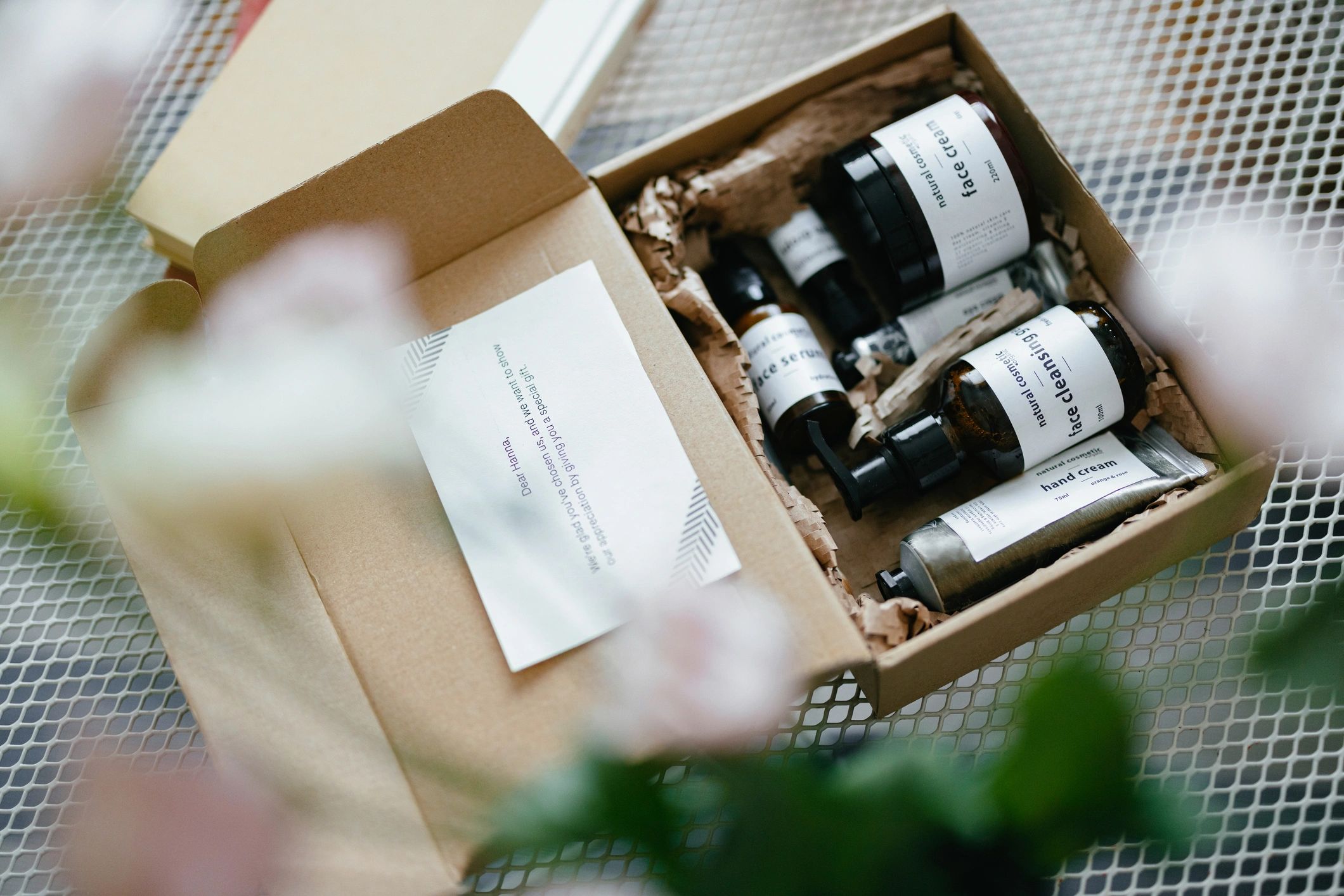 Open Gift Box With Natural Cosmetic Products Inside and Paper Note (Copy Space)